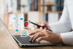 businessmen Are working on laptop and smartphone to use the search engine optimization tool. To find customers or promote and advertise online content for technology, marketing and business concept. photo