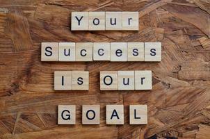 Your success is our goal text on wooden square, motivation quotes photo