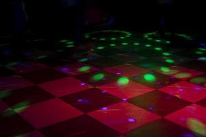 Floor in cage. Floor for dancing. Color music in hall. Bar interior. photo