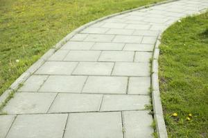 Path in park. Road from plates. Pedestrian area. photo