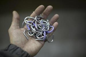 Chain in hand. Steel links. Lock in palm of your hand. photo