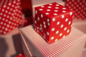 Gift wrapping, Beautiful Red Holiday Gift Boxes with a Gift for Christmas photo