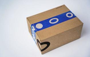 cardboard box sealed with blue adhesive tape from the delivery service photo