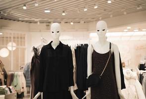 mannequins dressed in dresses in a fashion store photo