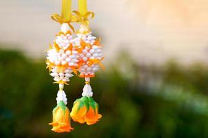 plastic flower garland,Buddhists like to use garlands for worshiping Buddha images or sacred things. and brought to pay homage to respected adults in various festivals. photo