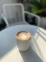 Coffee cup on table photo