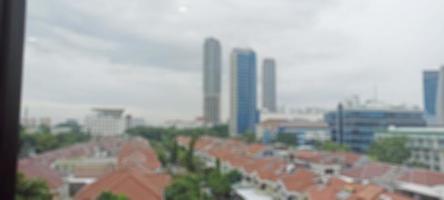 Jakarta, Indonesia. April 5, 2023. The background is residential and multi-storey buildings with clouds and blue sky photo