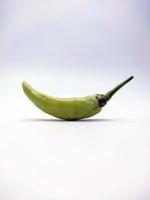 Light green chili pepper isolated on white background photo