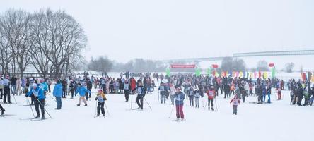 Annual All-Russian sports event action Ski Track of Russia. Sporty lifestyle for adults, children, family holiday on cross-country skiing - mass race on a snowy track. Russia, Kaluga - March 4, 2023 photo