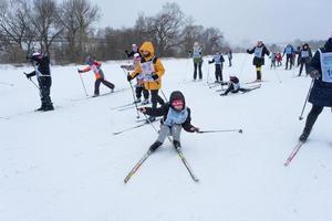 Annual All-Russian sports event action Ski Track of Russia. Sporty lifestyle for adults, children, family holiday on cross-country skiing - mass race on a snowy track. Russia, Kaluga - March 4, 2023 photo