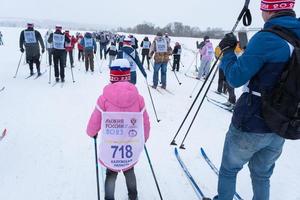 Annual All-Russian sports event action Ski Track of Russia. Sporty lifestyle for adults, children, family holiday on cross-country skiing - mass race on a snowy track. Russia, Kaluga - March 4, 2023 photo