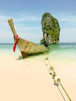 Longtail boat parked to wait for tourists at Ao Nang beach, Thailand. photo