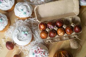 Painted eggs cooked for Easter are in the tray near the pies photo