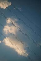 Sky and cables in a sunset full of clouds photo