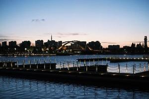 Deep blue water of Harbour Bridge at sunset photo