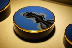 A copper-blue flange paperweight photo