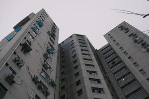 Look up at the grey Hong Kong residential buildings photo