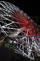 A Ferris wheel that spins at night