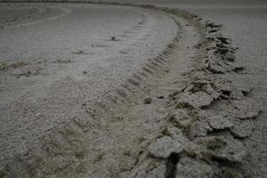 tire ruts on the beach photo