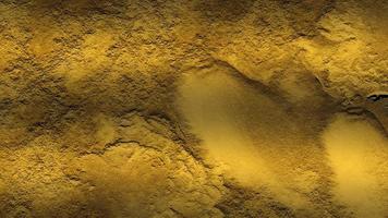 golden stone concrete texture. digital painting of gold texture background on the basis of paint. Aged rough golden stone wall surface with grunge texture for background. Natural golden. photo