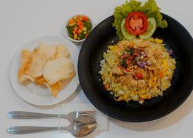 Fried rice sambal matah with crackers serving photo