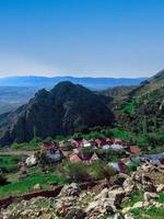 Glimpse into rural living Discover the tranquil charm of a group of houses in a rural area, a journey into the heart of peaceful and serene landscapes photo