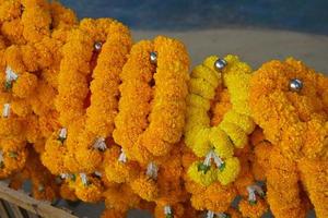 Marigolds, lotus flowers are brought to pay homage to the Lord Buddha. photo