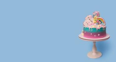 Banner with beautiful festive with unicorn children's cake on a stand on a blue background photo