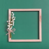 Summer or spring composition. Lily of the valley with square frame copy space top view. Summer, spring floral concept photo