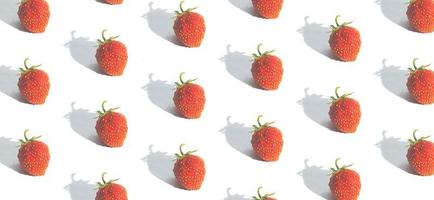 Banner with pattern with strawberries isolated on white. Abstract summer background photo