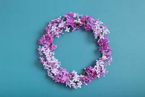 Lilac flowers wreath with copy space. Summer, spring floral composition flat lay, top view photo