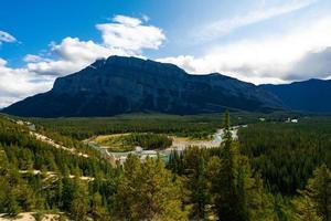 Tunnel Mountain Hoodoos Lookout in Alberta, Canada with stunning mountains and blue sky photo