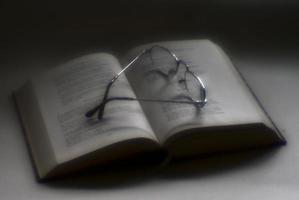 glasses on the book blur romantic photo