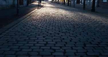 empty road cobblestones in the city photo