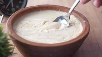 Fresh yogurt in a bowl on table video