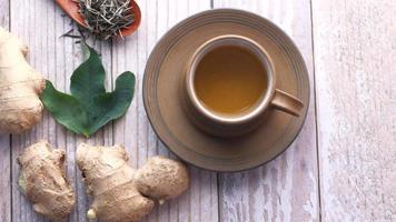 Top view of ginger tea on wooden background video