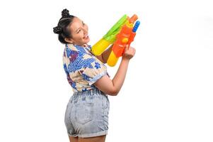 Portrait smiley woman in Songkran festival with water gun photo