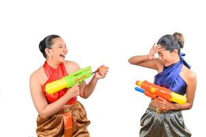 Two beautiful woman in Songkran festival with water gun photo