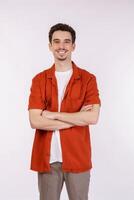 Portrait of young handsome man standing with crossed arms with isolated on studio white background photo