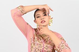 Young beautiful woman dress up local culture southern region showing beauty face posture photo