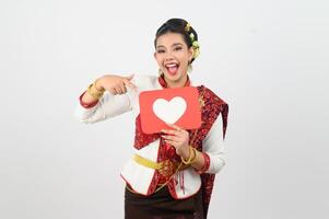 Young beautiful woman in Thai lanna costume with card card in heart symbol photo