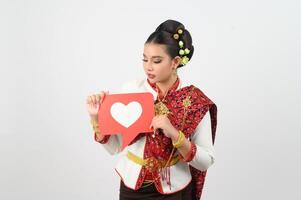 Young beautiful woman in Thai lanna costume with card card in heart symbol photo