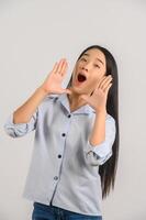 Portrait of young asian woman shout story or making announcement over isolated white background photo