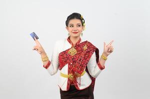 Young beautiful woman in northeastern dress show credit card posture photo