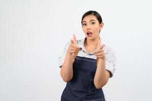 Portrait Asian young woman smile with happy in waitress uniform photo