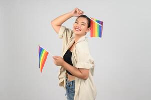 Pretty woman LGBQ pose with muli-color flag photo