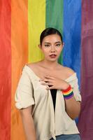 Pretty woman LGBQ pose with muli-color flag photo