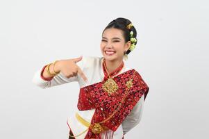 Young beautiful woman dres local culture in southern point finger posture photo