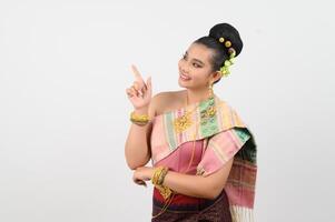 Young beautiful woman in northeastern dress stand and point finger posture photo