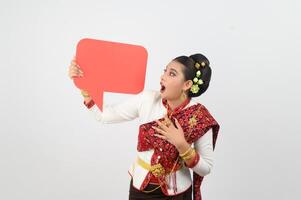 Young beautiful woman in Thai lanna costume with blank speech bubble sign photo